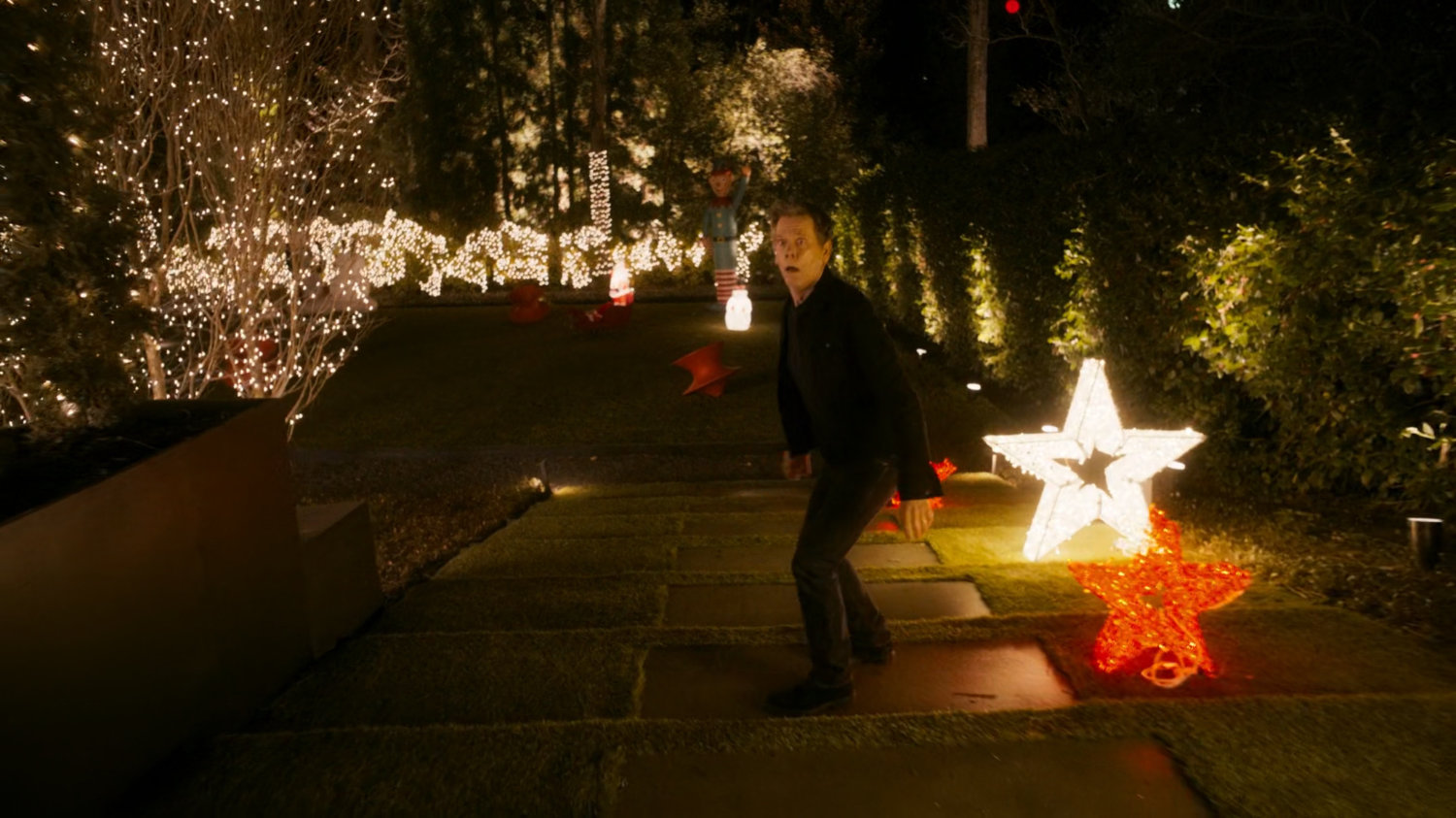Kevin Bacon runs through his backyard.