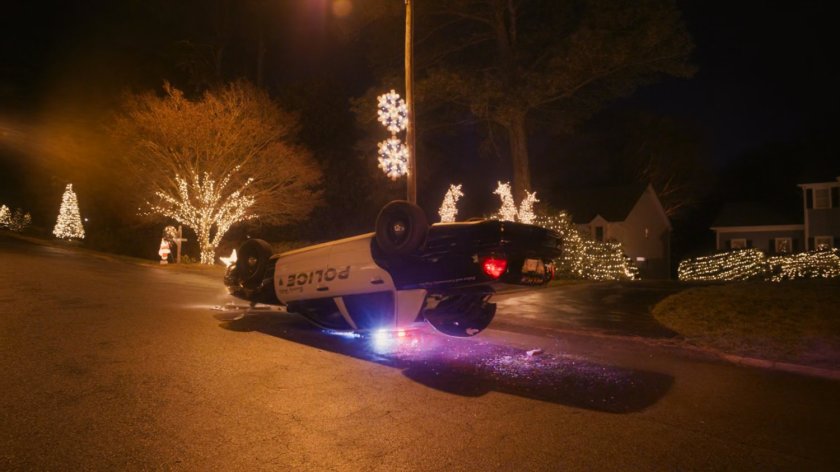 Drax flips a police car.