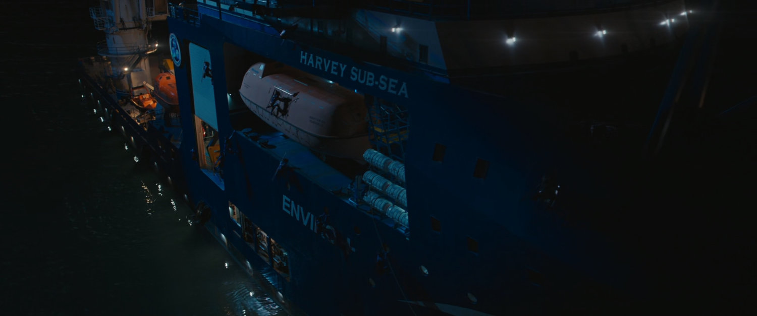 A boat at night on the water.