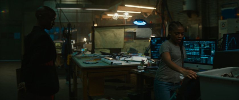 Okoye and Riri in a Boston warehouse at night.