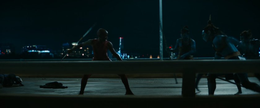 Attuma and Namora fight Okoye on Boston bridge at night.