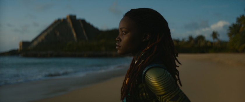 Nakia on beach by Mayan pyramid.