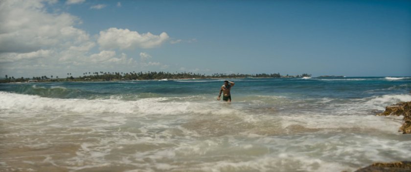 Namor walks out of ocean.