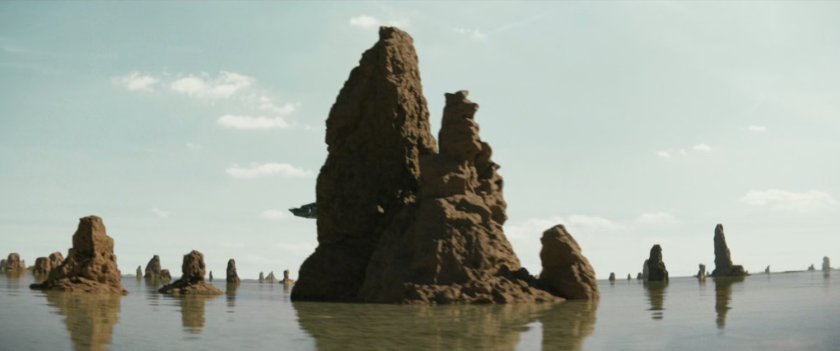 Island rock formations in shallow water.