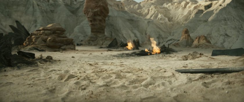 Wreckage of Talon fighter on desert island.