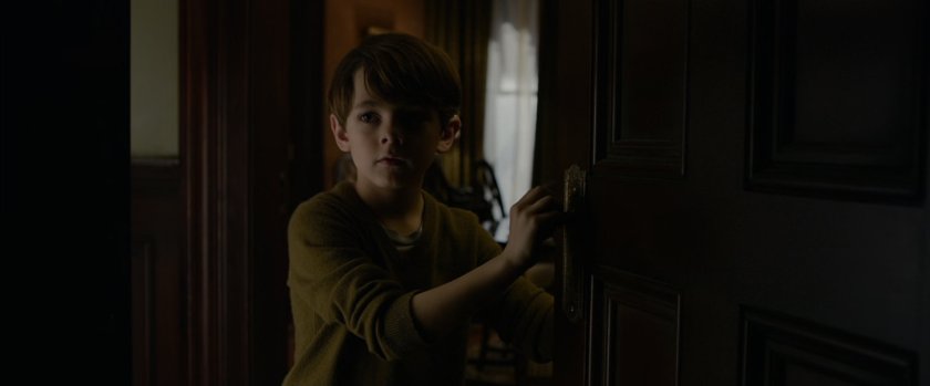 A young Peter Parker explores his parents house.