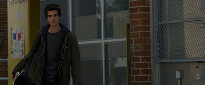 Peter Parker outside a school building.