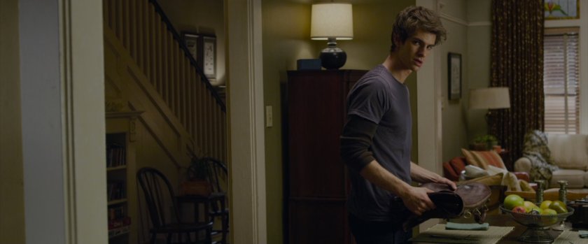 Peter Parker sets the dinner table.