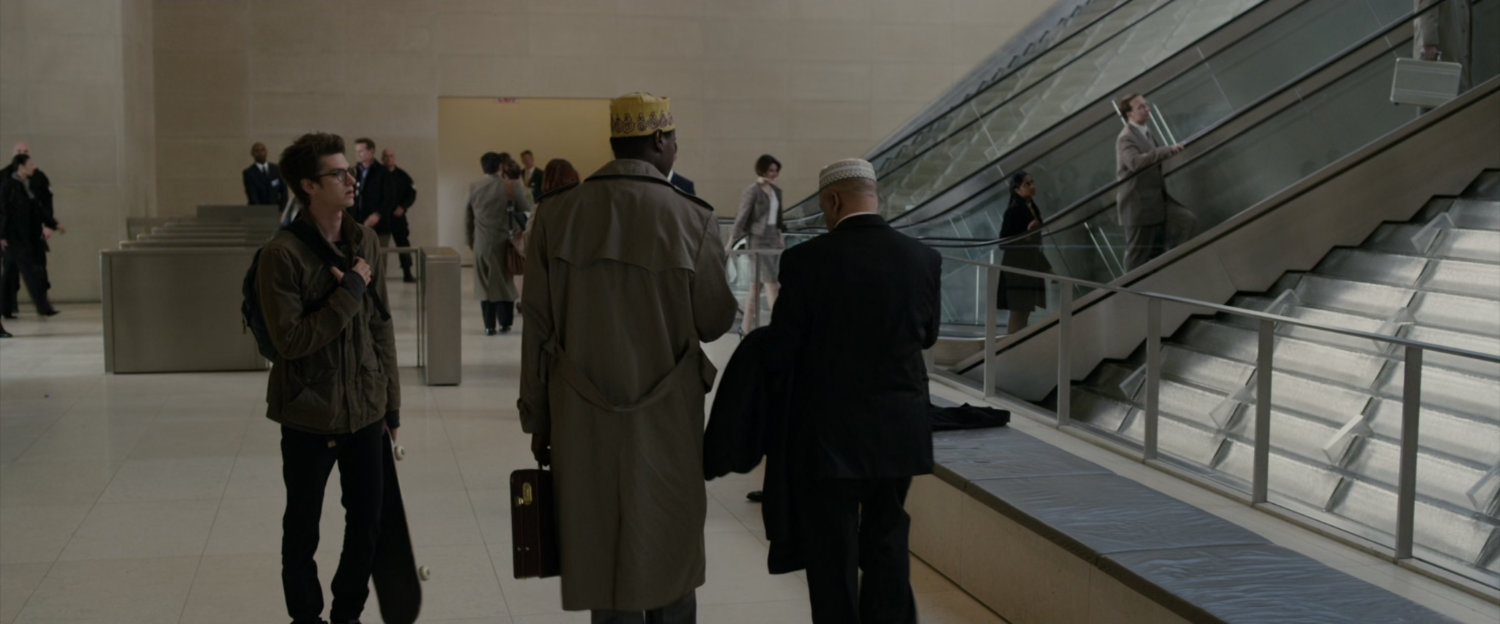 Peter Parker in the lobby of Oscorp Tower.