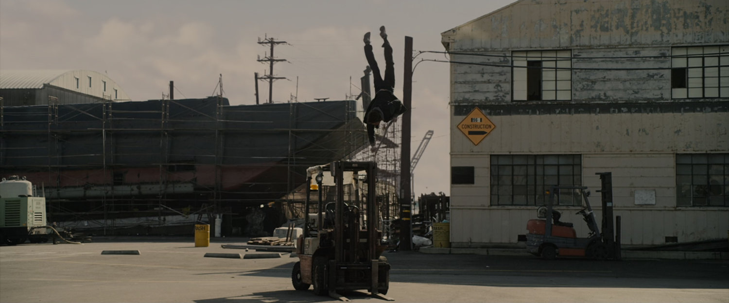 Peter Parker practices skateboarding at the marina.