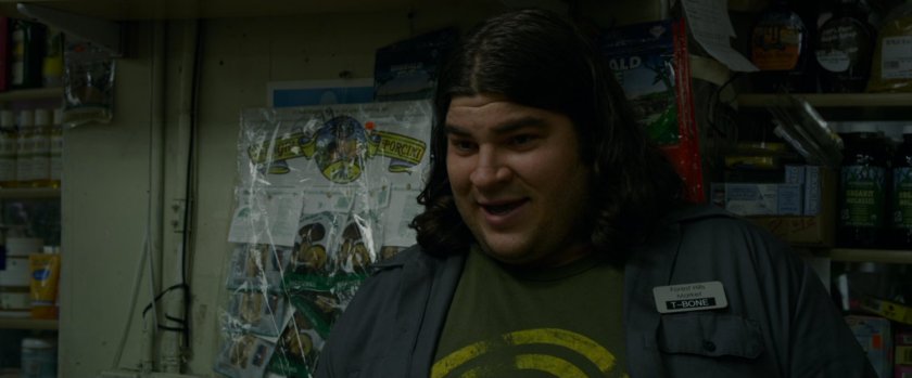 The cashier (name tag: T-Bone) of a bodega.