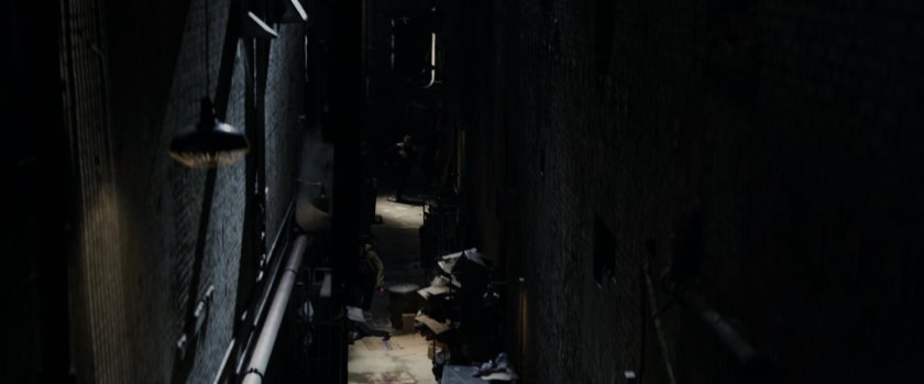A dark New York alley.
