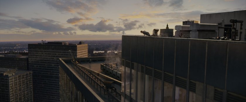 Peter Parker on the roof of a skyscraper.