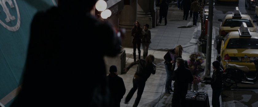 Spider-Man witnesses a thug running down a sidewalk.