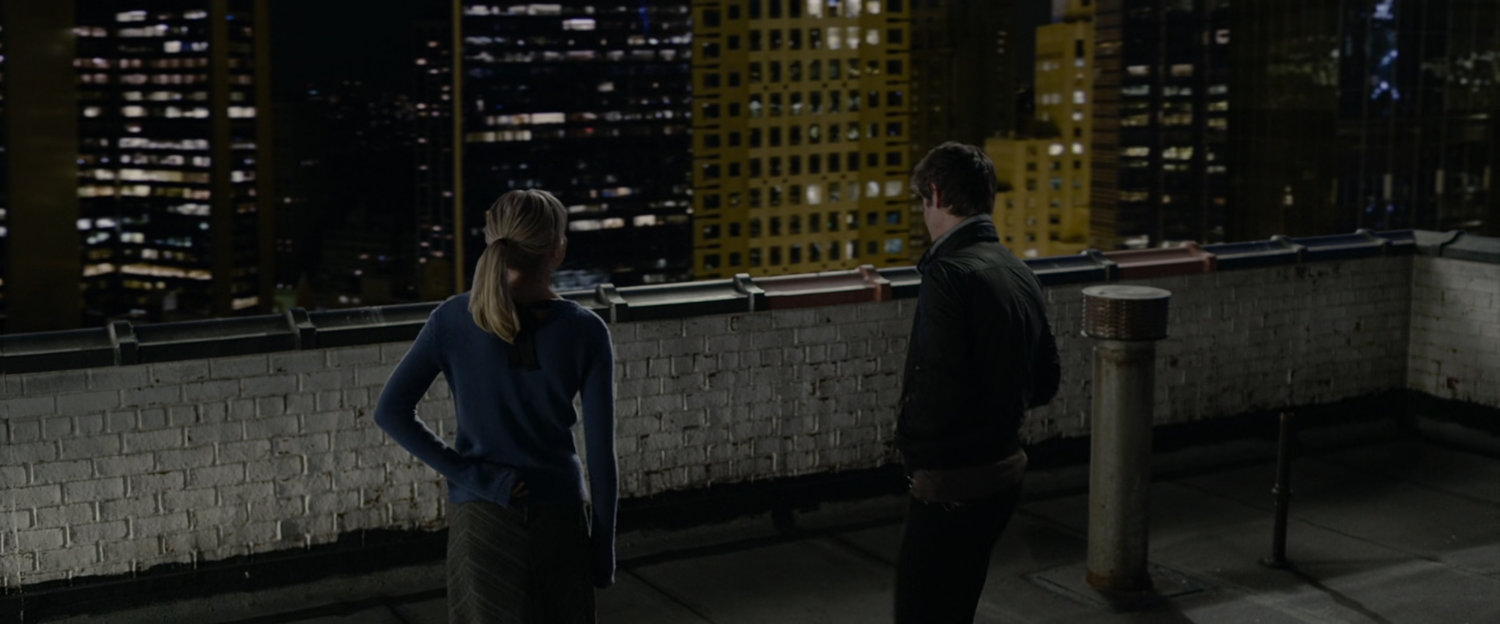 Gwen and Peter Parker on a rooftop.