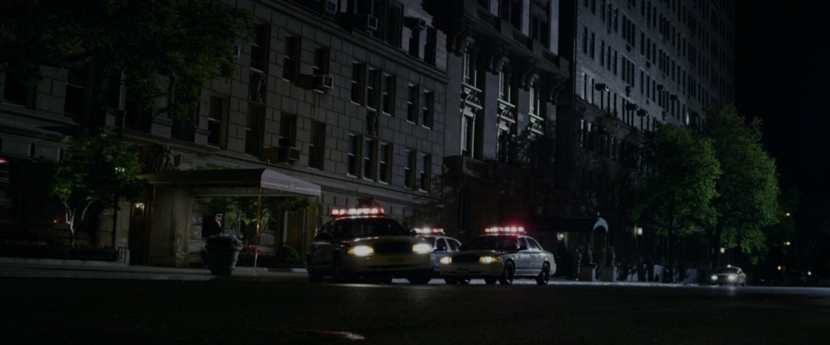 Police cars in front of Captain Stacy's apartment building.