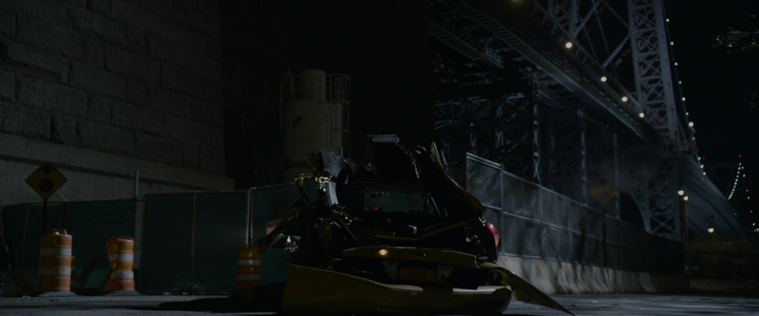 A car wreck off the side of the Williamsburg Bridge.