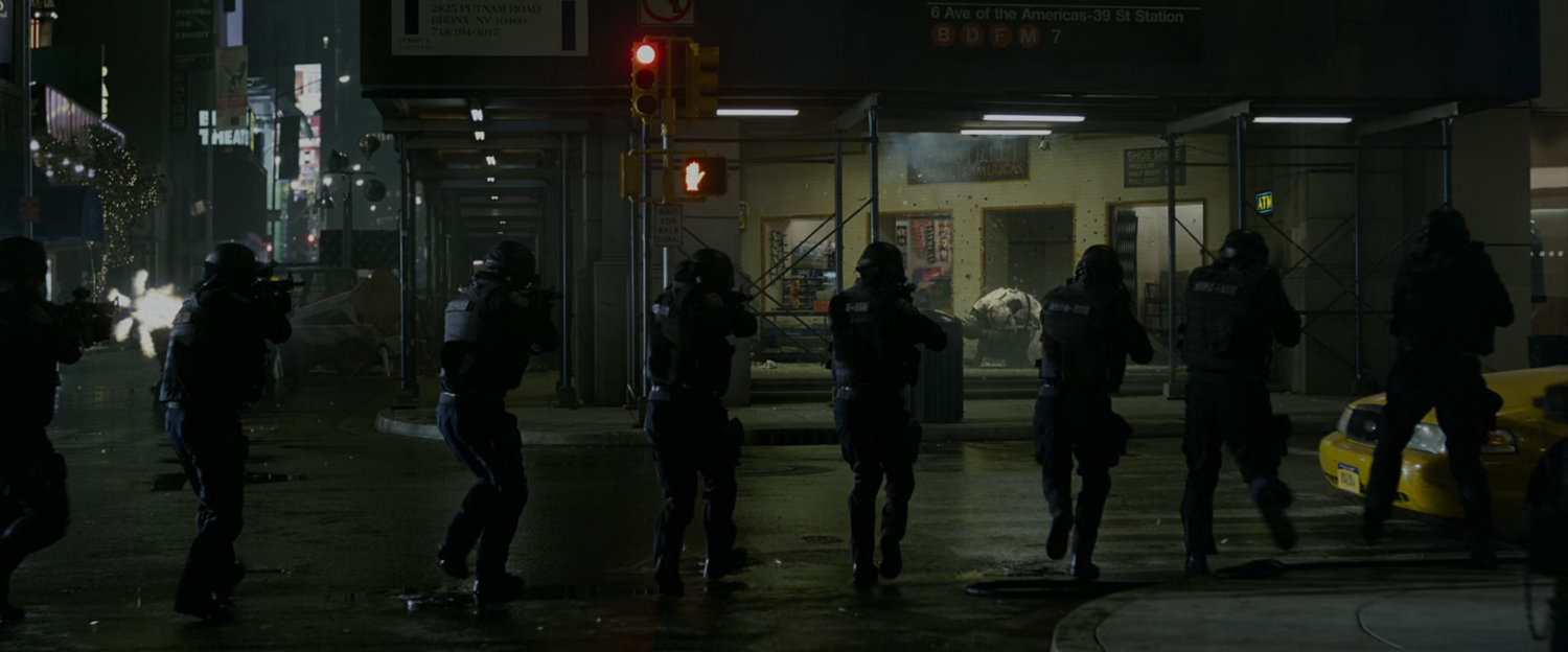 The police fire their guns into a corner subway station entrance.