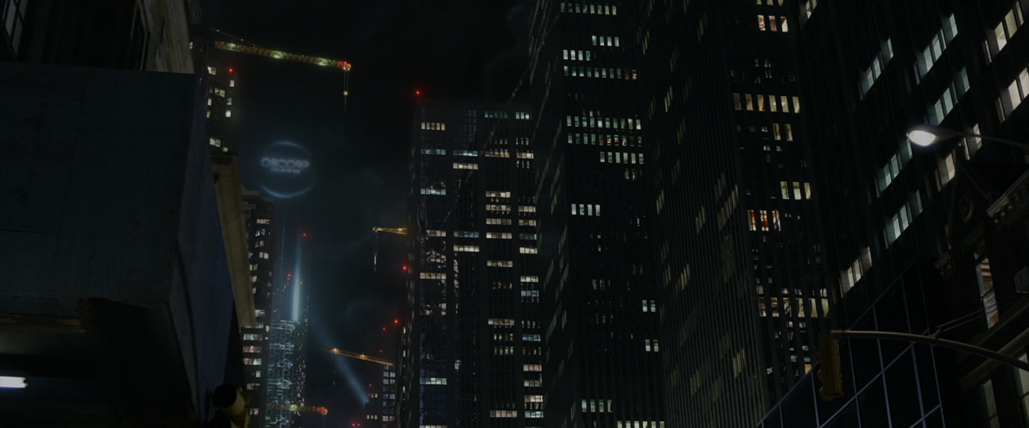 Night shot of cranes on New York skyscrapers including Oscorp Tower.