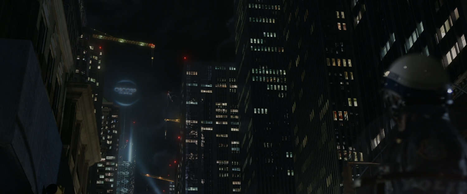 Night shot of cranes on New York skyscrapers including Oscorp Tower.