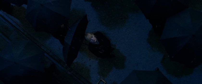 Gwen Stacy looking up at church roof in rain.