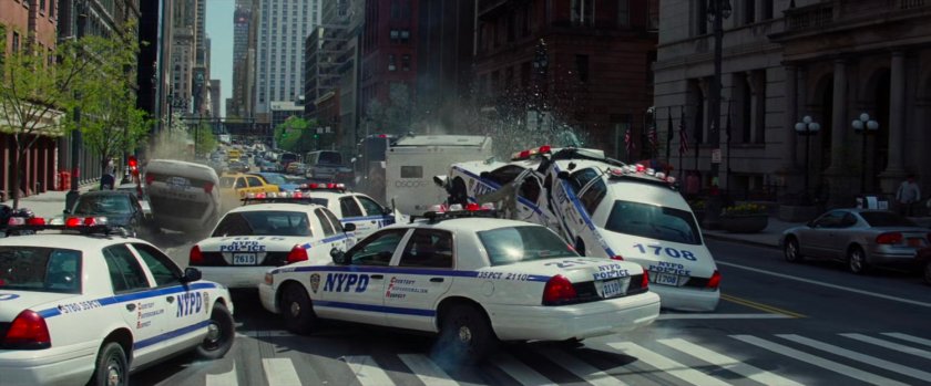 Police cars crash during chase through New York street.
