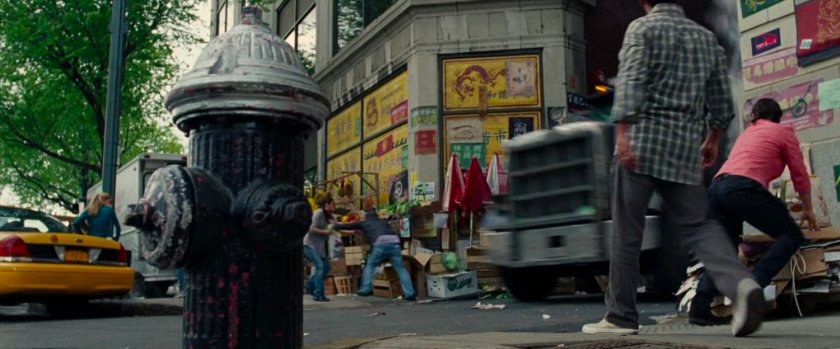 Tow truck crashes out of alley into Chinatown.