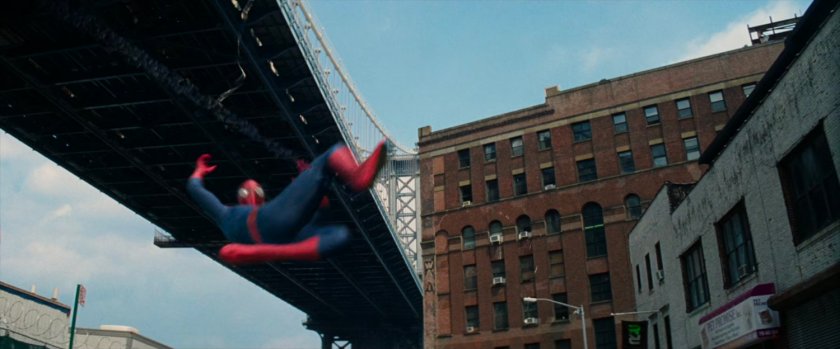 Spider-Man swinging under bridge.