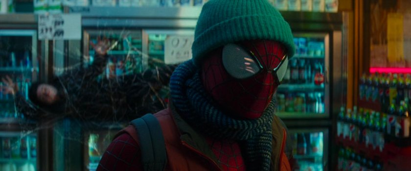 Spider-Man in bodega with webbed robber.