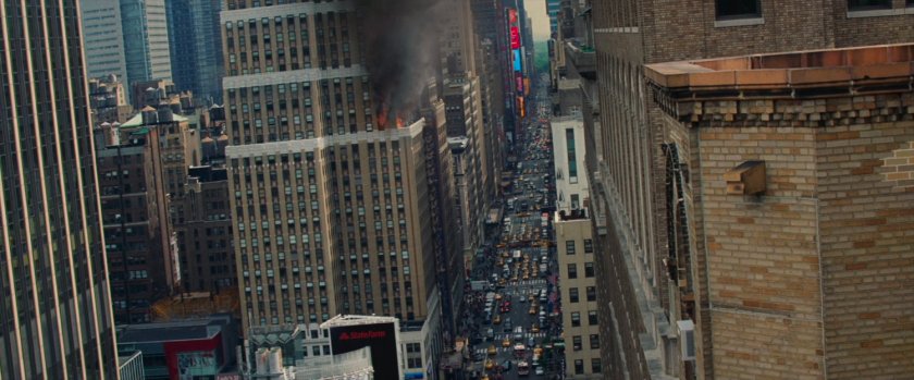 POV from atop a building looking up a busy New York street.