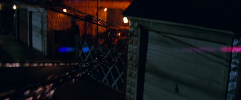 Wires running into garage from an alley.