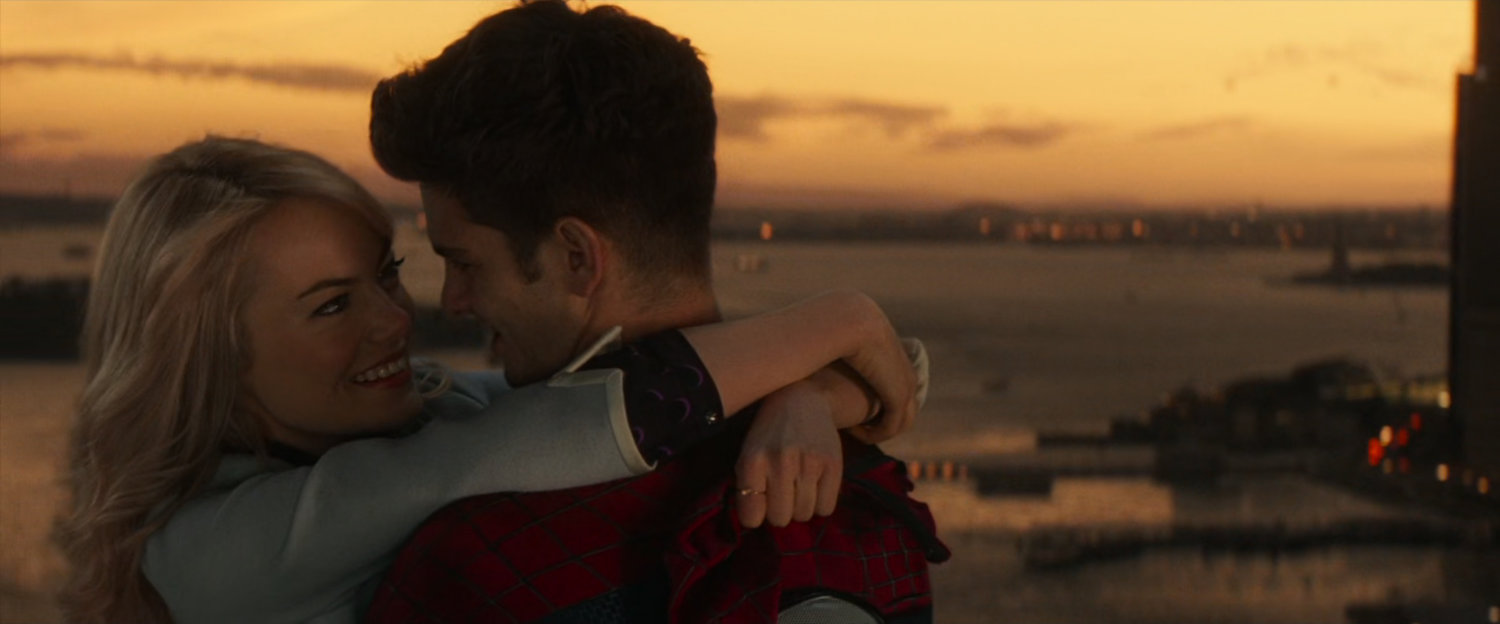 Peter and Gwen embrace at sunset.