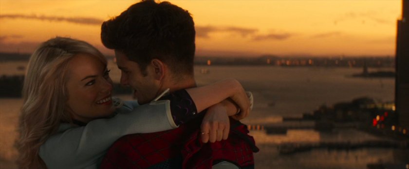 Peter and Gwen embrace at sunset.