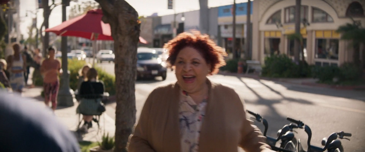 A woman on a San Francisco sidewalk.