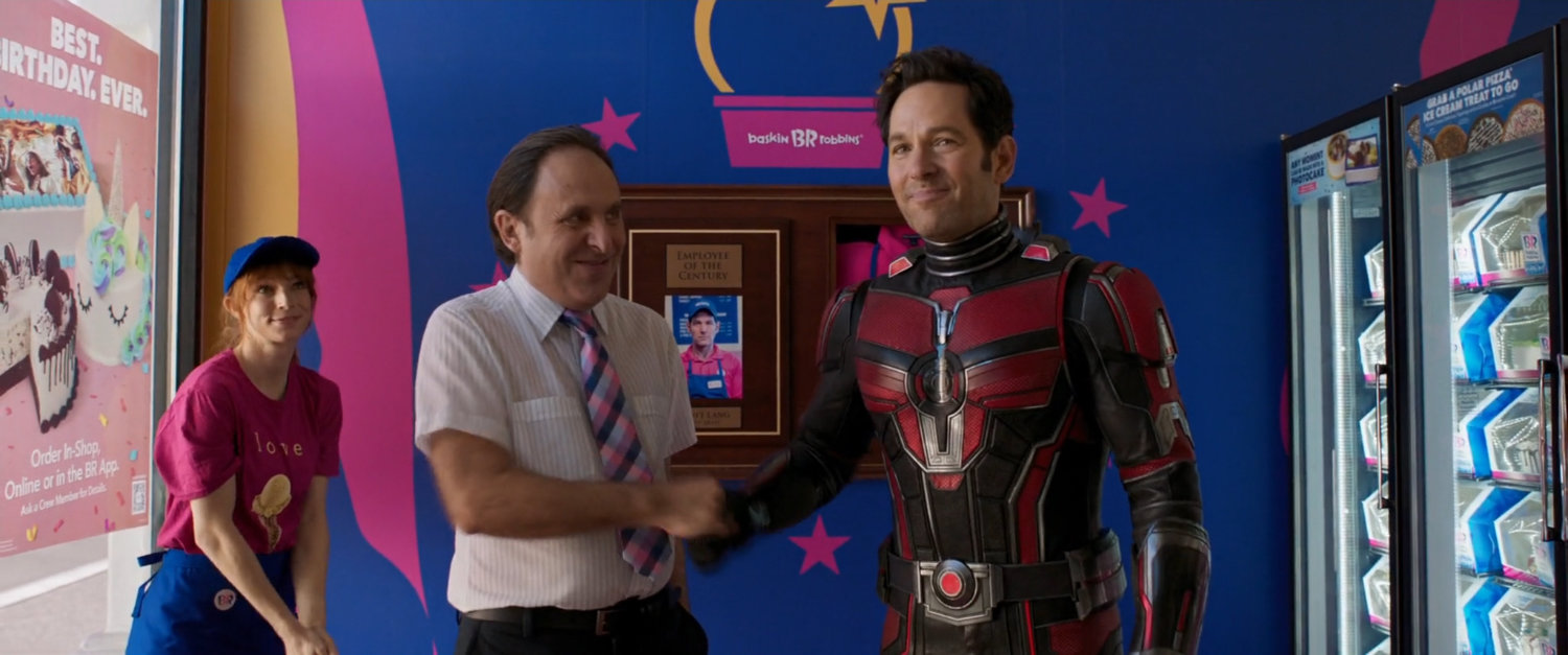 Scott Lang shaking hands with the manager of Baskin-Robbins.