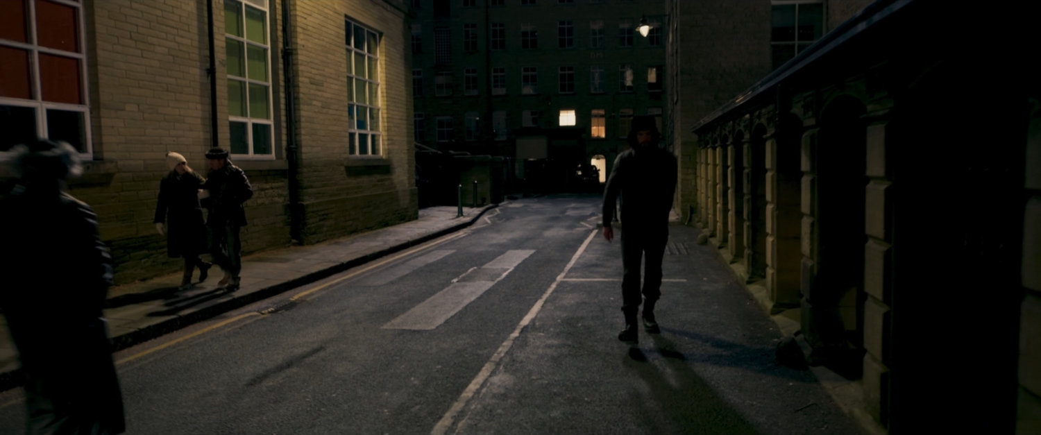 POV of Agent Ross on a dark Moscow sidewalk followed by someone.