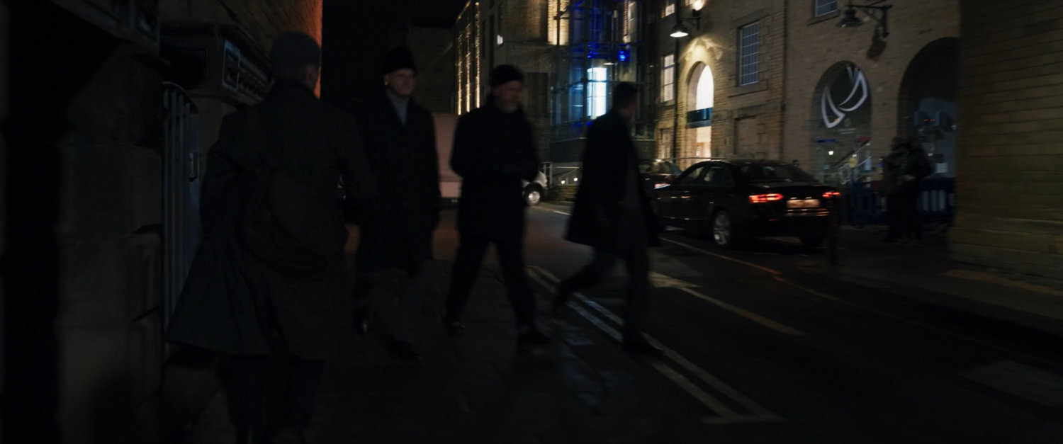 Agent Ross on a dark Moscow sidewalk followed by someone.