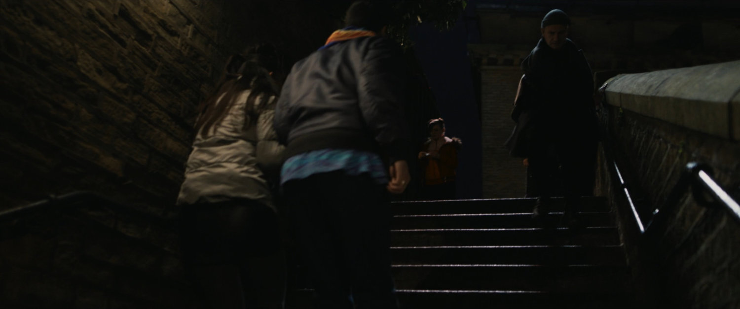 Agent Ross descending Moscow staircase.