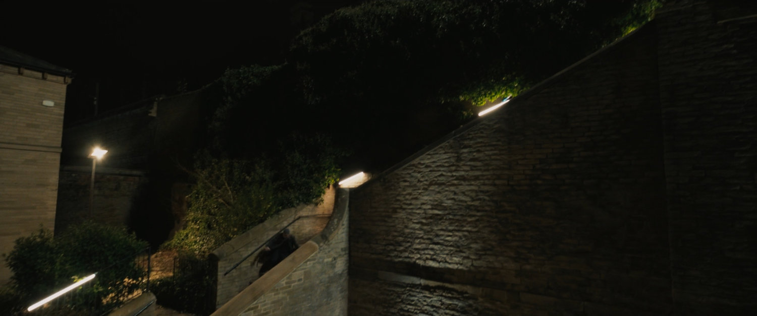 Agent Ross descending Moscow staircase.