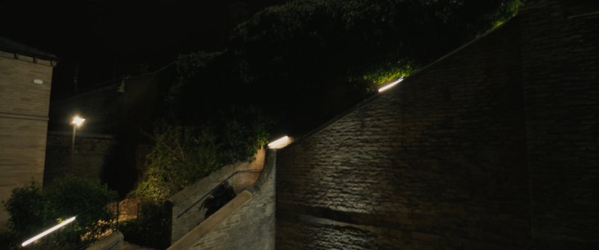 Agent Ross descending Moscow staircase.