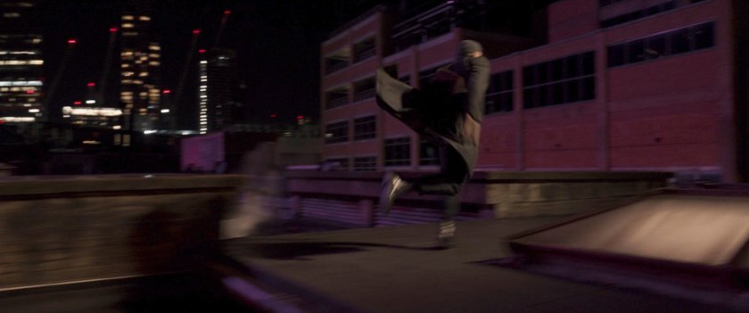 Agent Ross running across Moscow rooftop.