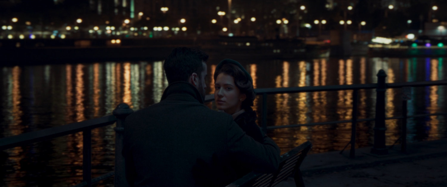 A couple on a park bench by Moscow river.