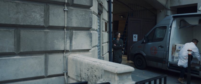 G'iah watching a man load up a van outside a Moscow building.