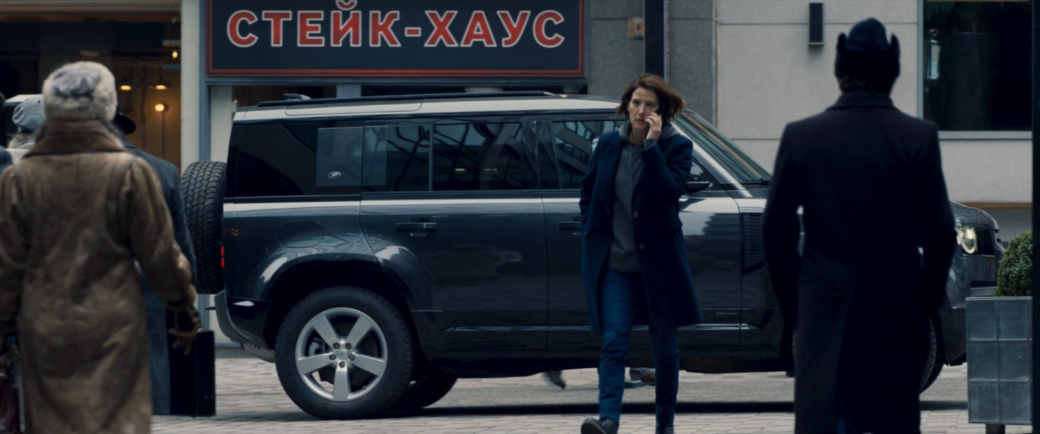 Maria Hill's on phone, walking towards a Moscow business square.