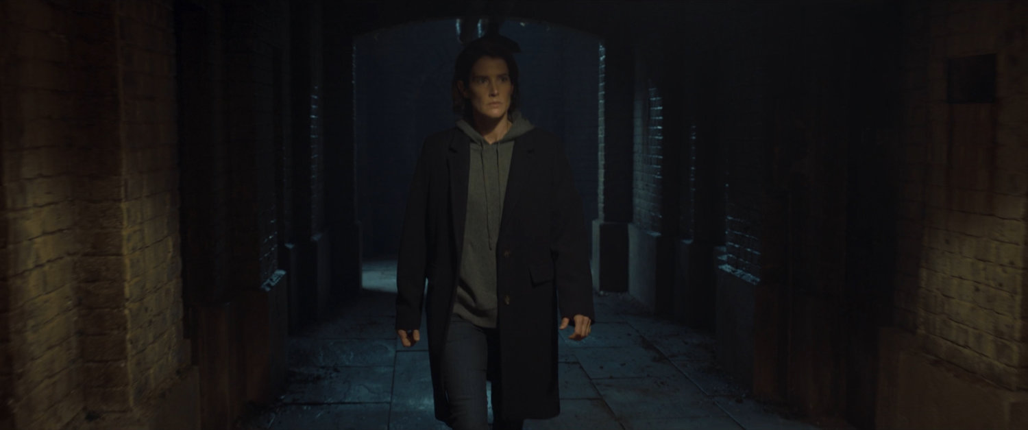 Maria Hill in a dark Moscow subway tunnel.
