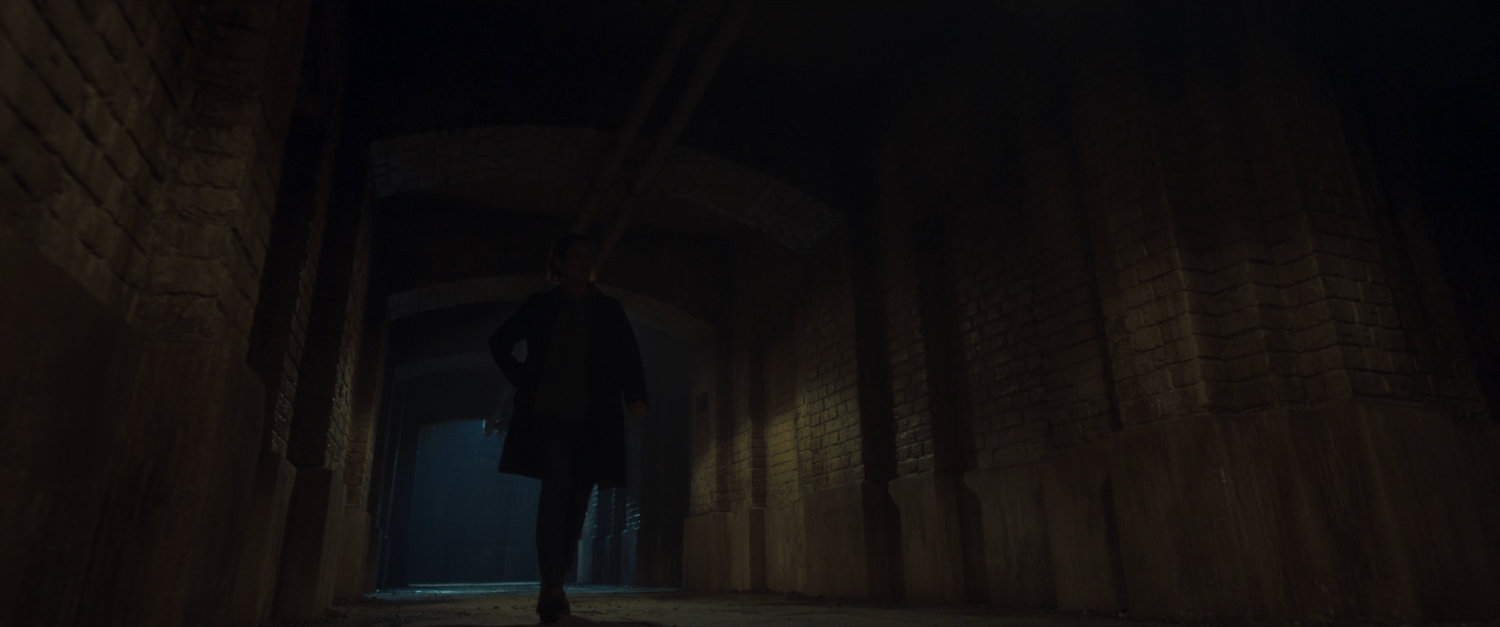 Maria Hill in a dark Moscow subway tunnel.