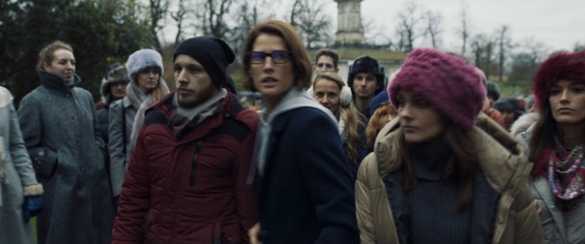 Maria Hill navigating through crowds in a Russian park.