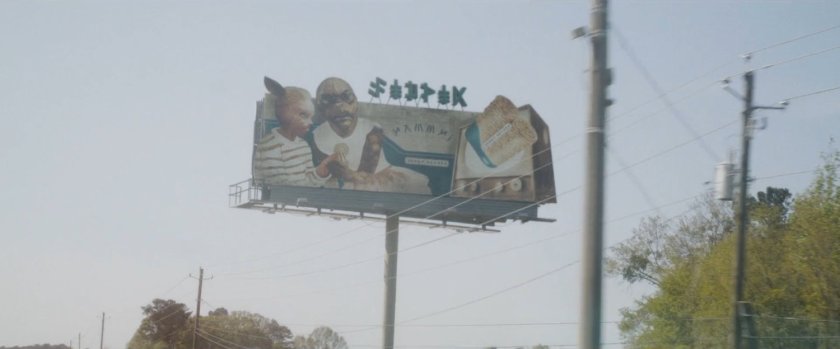 An alien billboard on a Counter-Earth highway.