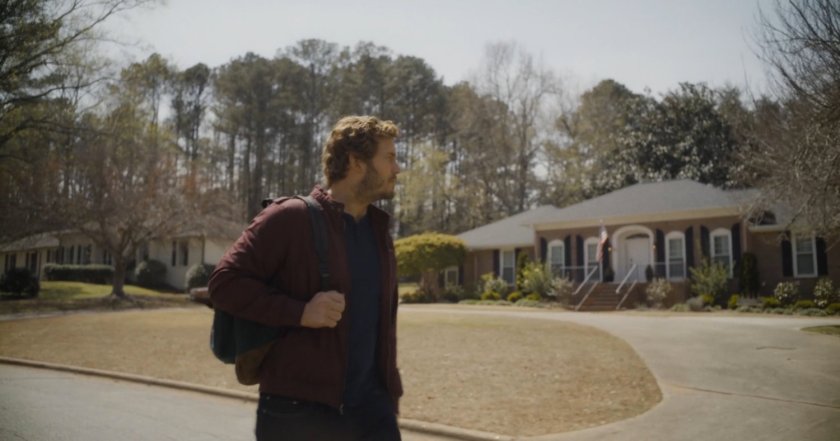 Peter Quill walks through a St Louis suburban neighborhood.