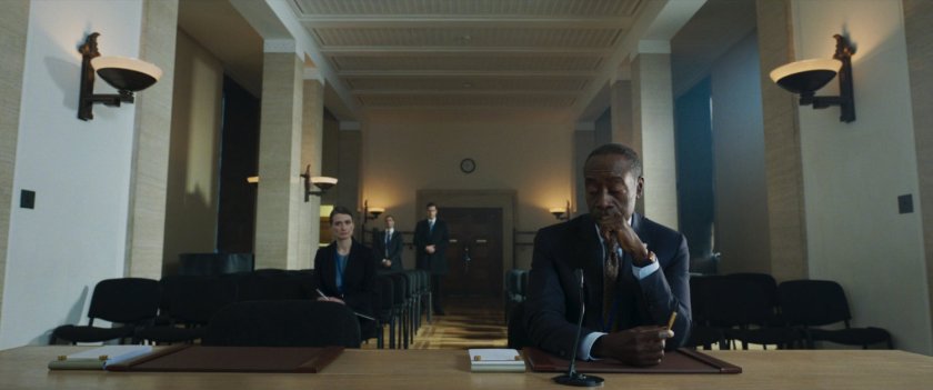 Colonel Rhodes and his security team, inside a small meeting chamber.